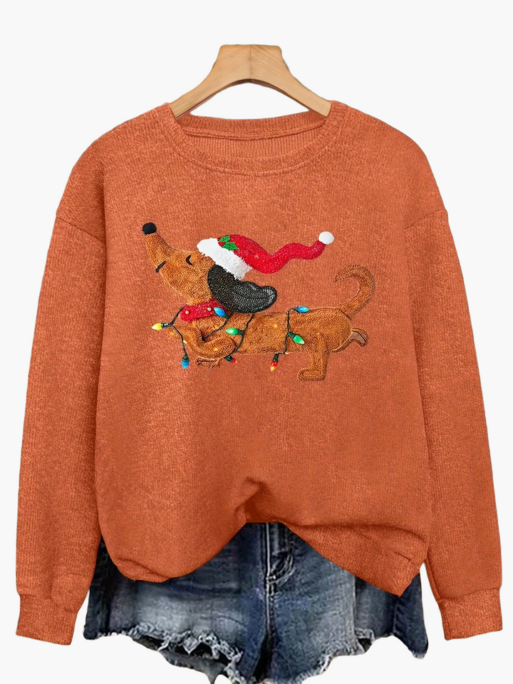 Detailaufnahme: Festlicher Damen Weihnachtspullover mit Dackelmotiv, weicher Strick für kalte Tage.