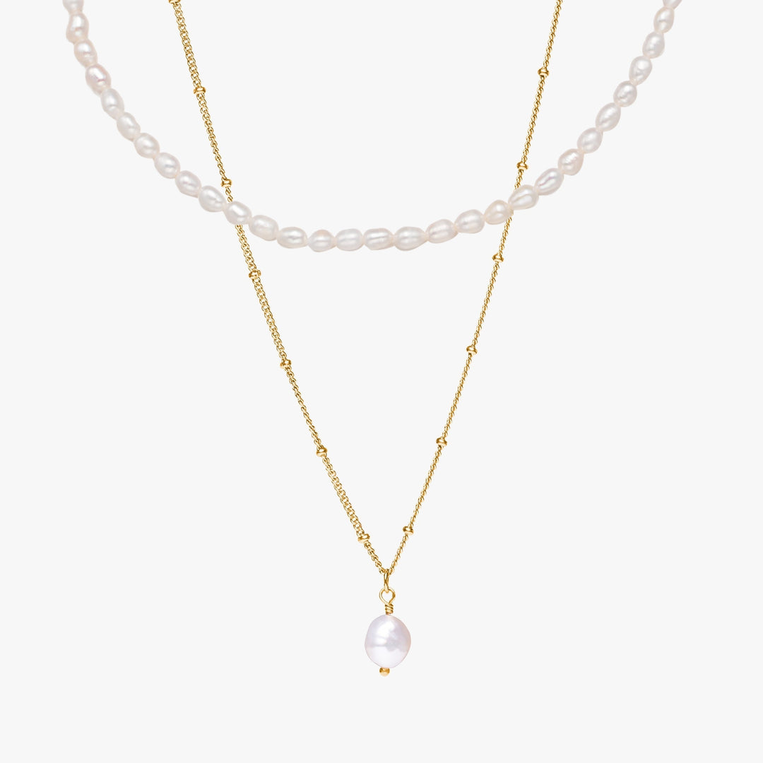 Goldene Damen Halskette mit einzigartigen Barockperlen, Teil eines edlen Schmucksets.