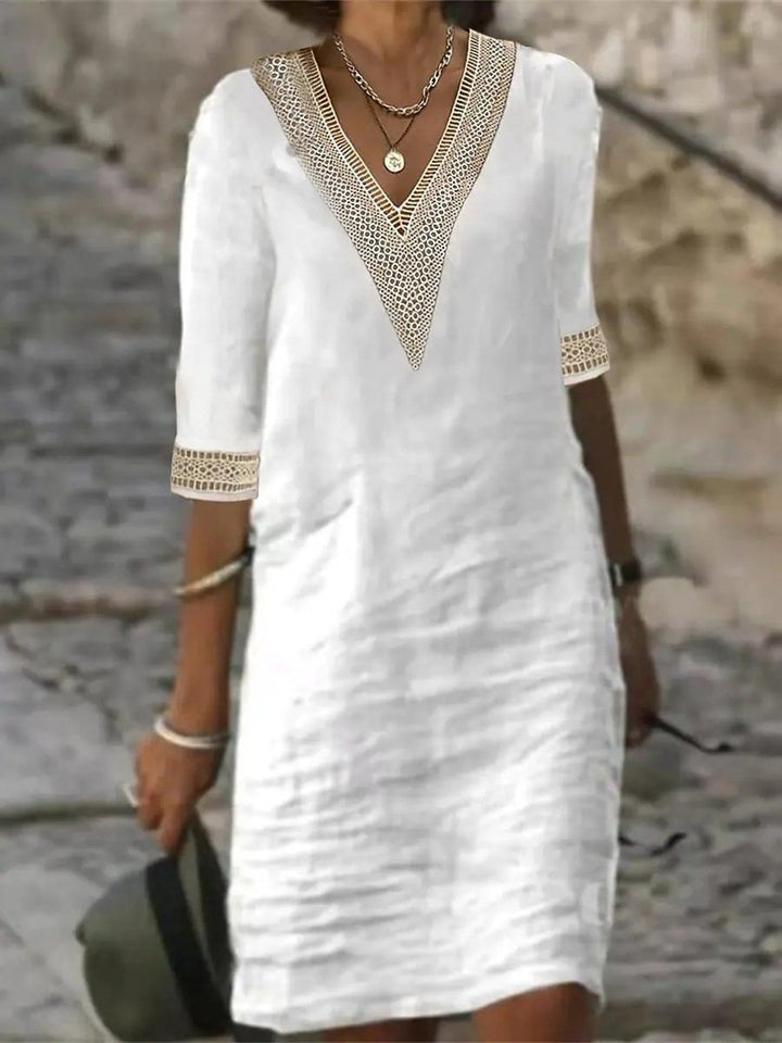 Damen Sommerkleid mit V-Ausschnitt, detailliertem Spitzenbesatz und praktischen 3/4-Ärmeln für den Alltag.