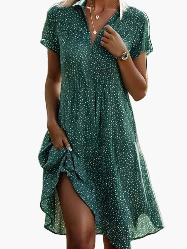 Elegantes Damen Sommerkleid mit V-Ausschnitt, gepunktetem Muster, A-Linie und Kurzarm für warme Tage.