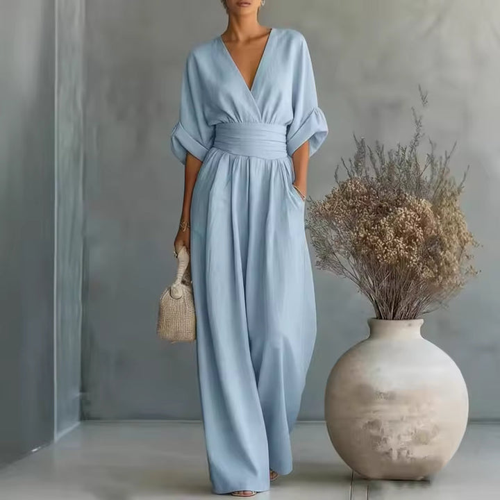 Eleganter Damen-Jumpsuit mit V-Ausschnitt und weitem Bein, perfekt für festliche Anlässe und Abendmode.