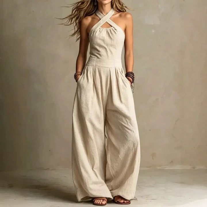 Festlicher Damen Jumpsuit in Anthrazit mit Halterneck und weitem Bein, ideal für Abendmode.
