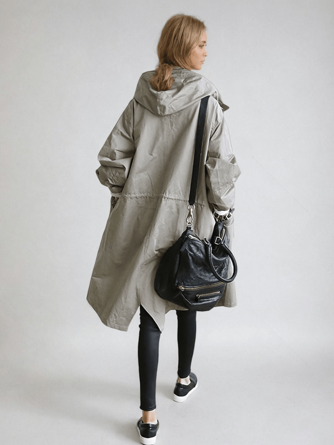 Damen Oversized Trenchcoat mit Kapuze, wasserabweisend. Perfekt für Frühling & Herbst.