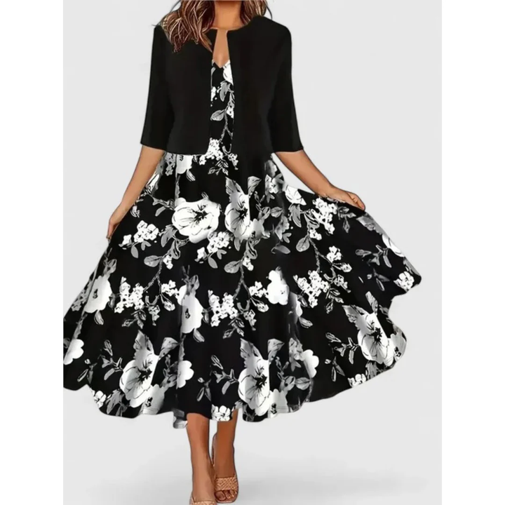 Elegantes Damen Midikleid mit 3/4 Ärmeln, ausgestelltem Rock und floralem Muster im Boho-Stil. Ein stilvoller Zweiteiler.