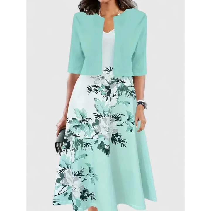 Damen Midikleid Set mit kurzem Cardigan, Blumenmuster und ausgestelltem Rock. Ein elegantes Freizeitkleid im Boho-Stil.