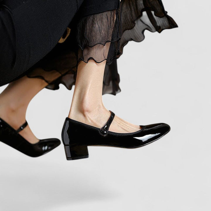 Elegante Mary-Jane-Damenschuhe mit flacher Sohle und Schnallenriemen, ideal für Freizeit und Business, bequemer Stil.