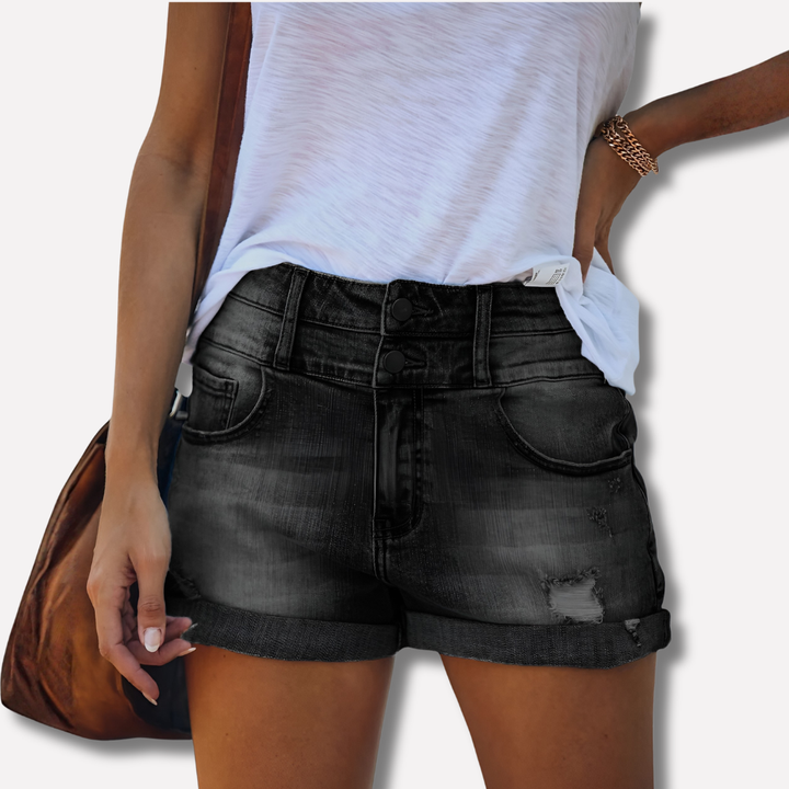 Stylische schwarze High Waist Jeansshorts für Damen mit Umschlag und Knopfdetails.