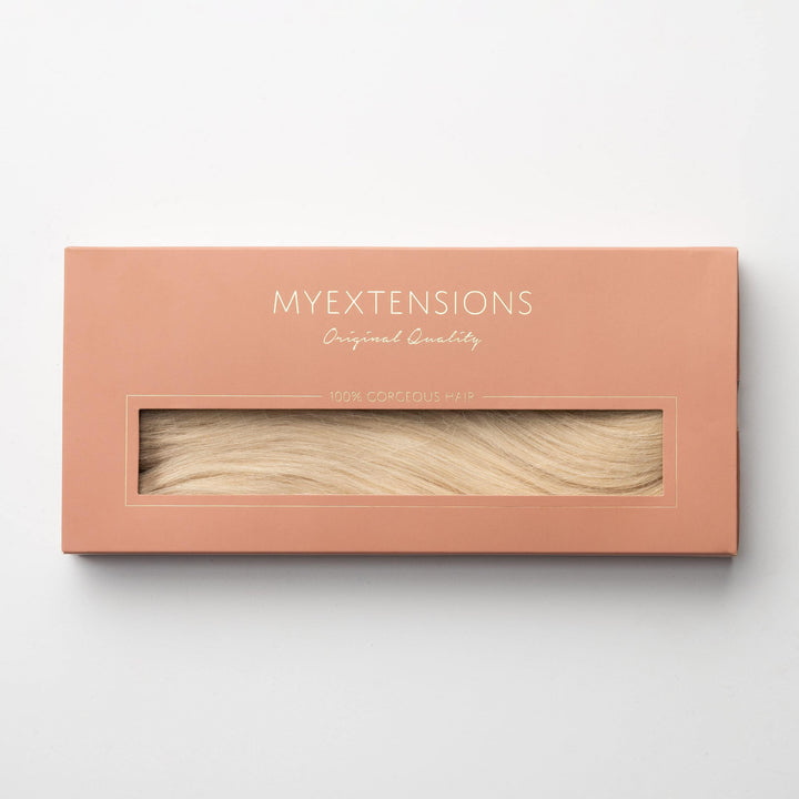 Natürliche Echthaar-Extensions zum Anklippen für Damen. Helles Aschblond 60B für einen einfachen, blonden Look.