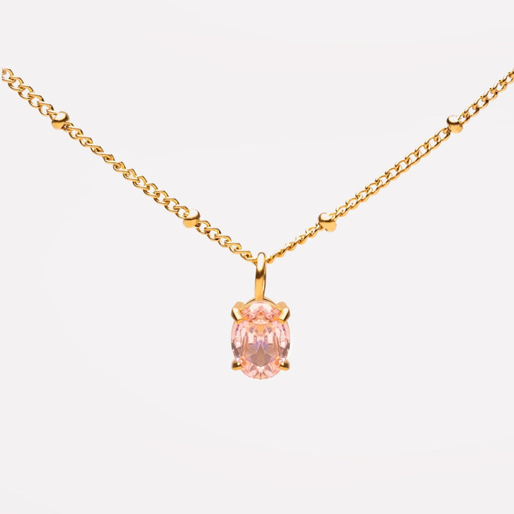 Damen Halskette Gold mit funkelndem rosa CZ Anhänger aus robustem Edelstahl.
