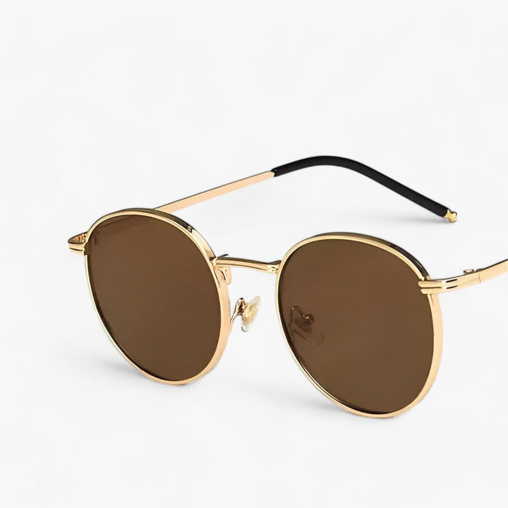 Runde Unisex Sonnenbrille im Retro-Stil. Perfekt für Modebewusste, bietet hohen UV-Schutz.