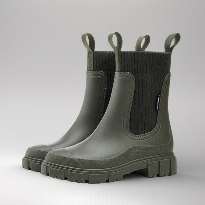 Stylische grüne Regenstiefel für Damen, wasserdicht, halbhoch & elegant, perfekt bei Nässe.