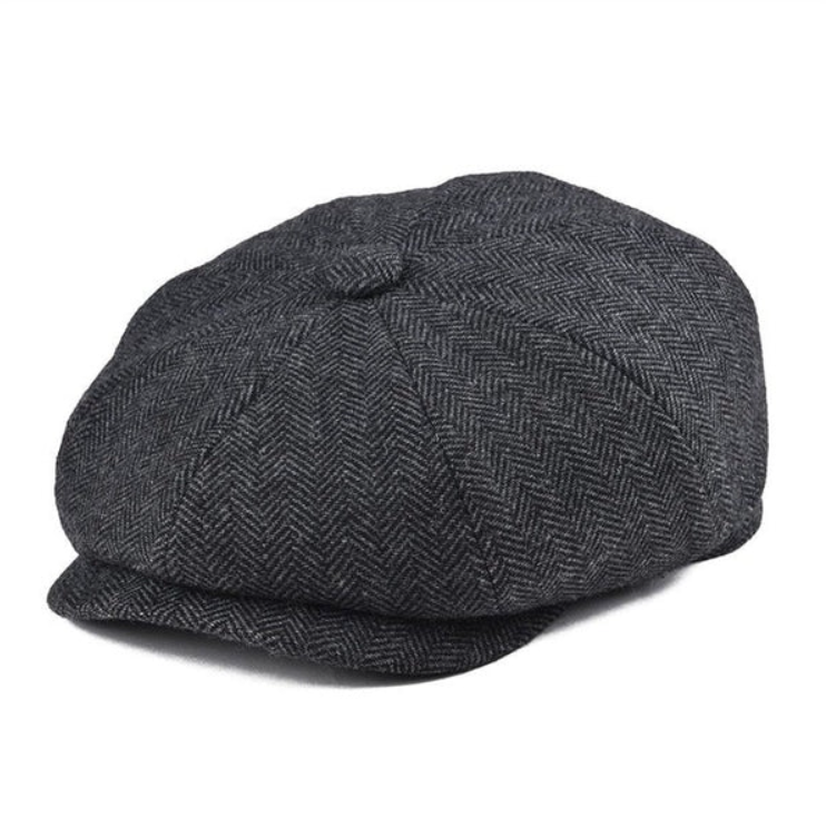 Modisches Herren Accessoire: blaue Schiebermütze mit Fischgrätmuster im Retro Vintage Look.