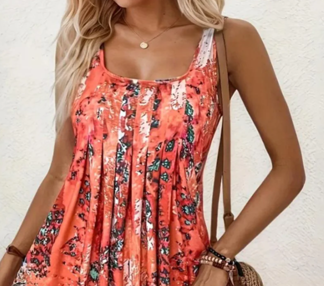 Trendiges oranges Damen A-Linien Minikleid mit lebhaftem Print, ärmellos, perfekt als Sommer- oder Urlaubskleid.