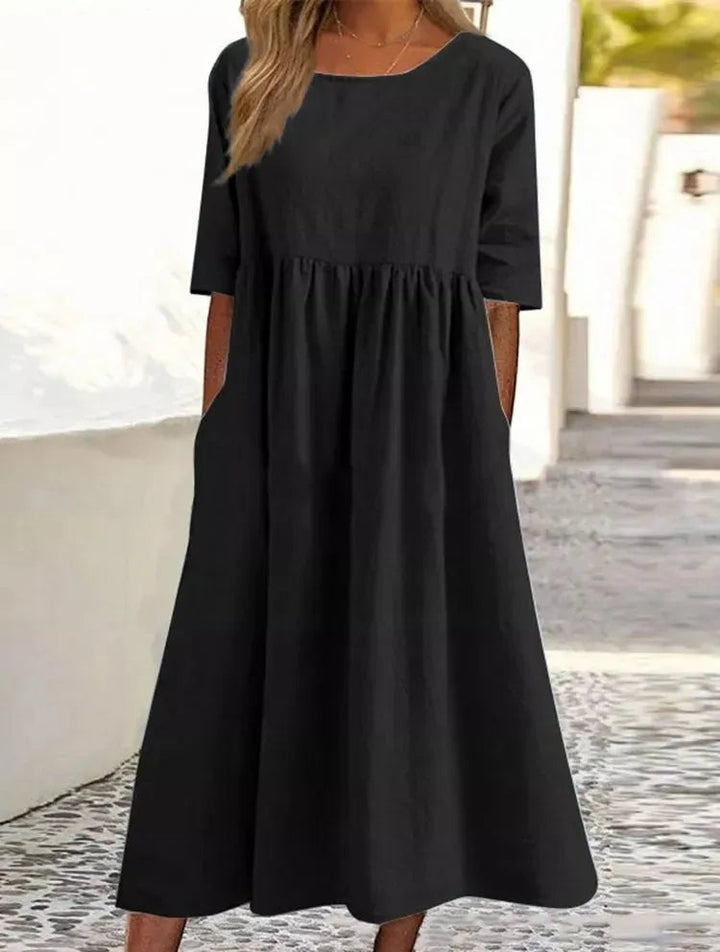 Lockeres Damen Alltagskleid mit Kurzarm, Rundhals und seitlichen Taschen, sehr komfortabel.
