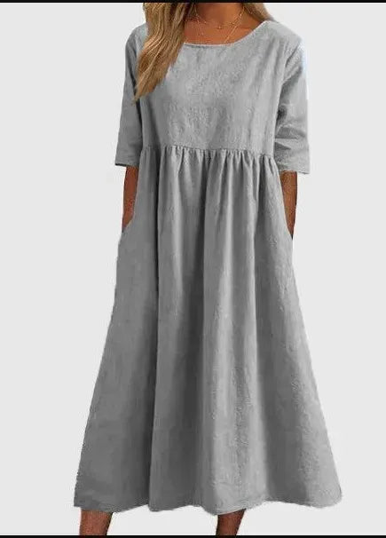 Elegantes Damen Kurzarmkleid mit Rundhals und Taschen, perfekt für Frühling und Sommer.