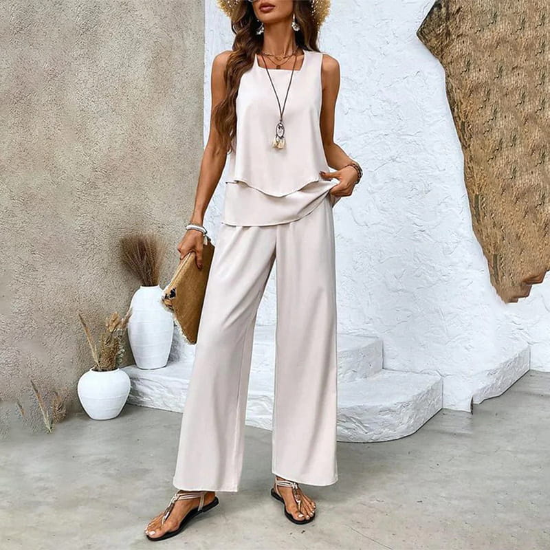 Modernes Damen Zweiteiler Set mit Allover-Blattdruck. Ärmellos und weite Hose für hohen Komfort.