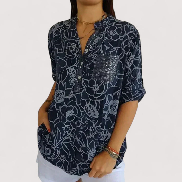 Elegante Damenbluse mit farbenfrohem floralem Muster; leicht, atmungsaktiv, locker & vielseitig tragbar.