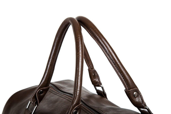 Schwarze Leder-Reisetasche, großes Fassungsvermögen, strapazierfähig, ideal für längere Reisen.
