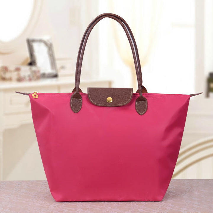 Vielseitige Damen Canvas Handtasche, robuster Allrounder für Reise und Einkauf mit Leder.
